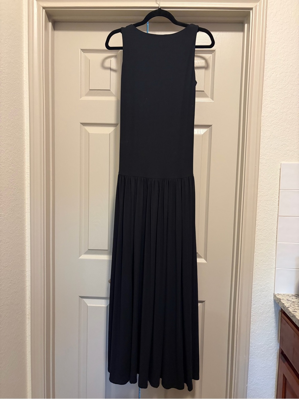 Sleeveless Low Black Maxi Dress with Pleated Skirt